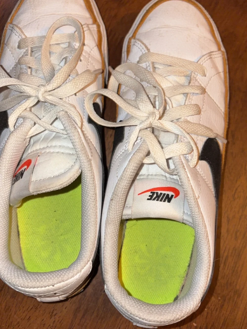 Nike Kids White Sneakers with Black Swoosh and Neon Green Insole